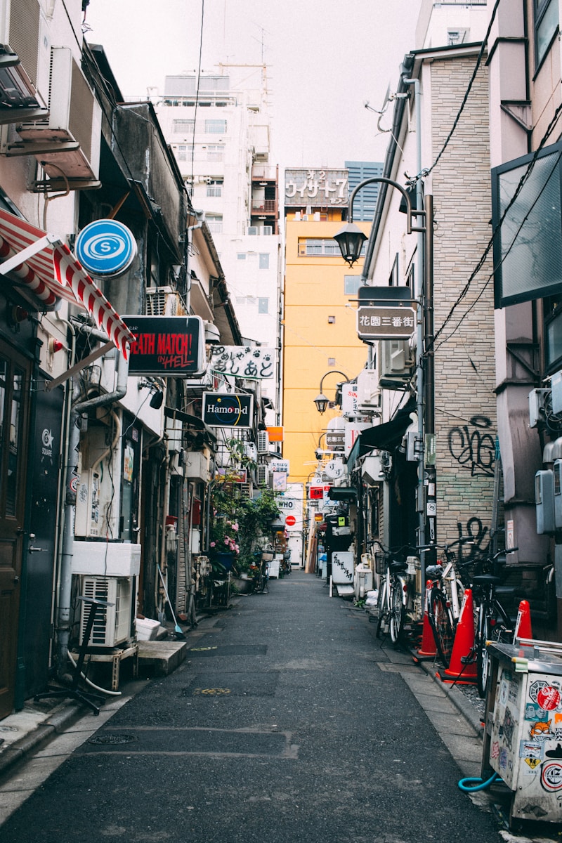 street between gray concrete buildings